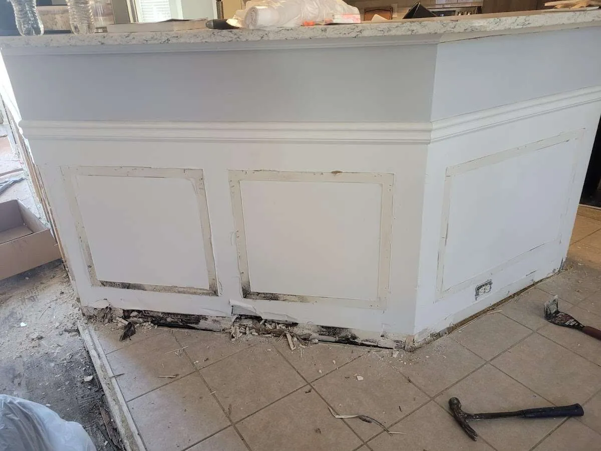 Water damage and mold on kitchen during Storm Damage Restoration in Le Ray